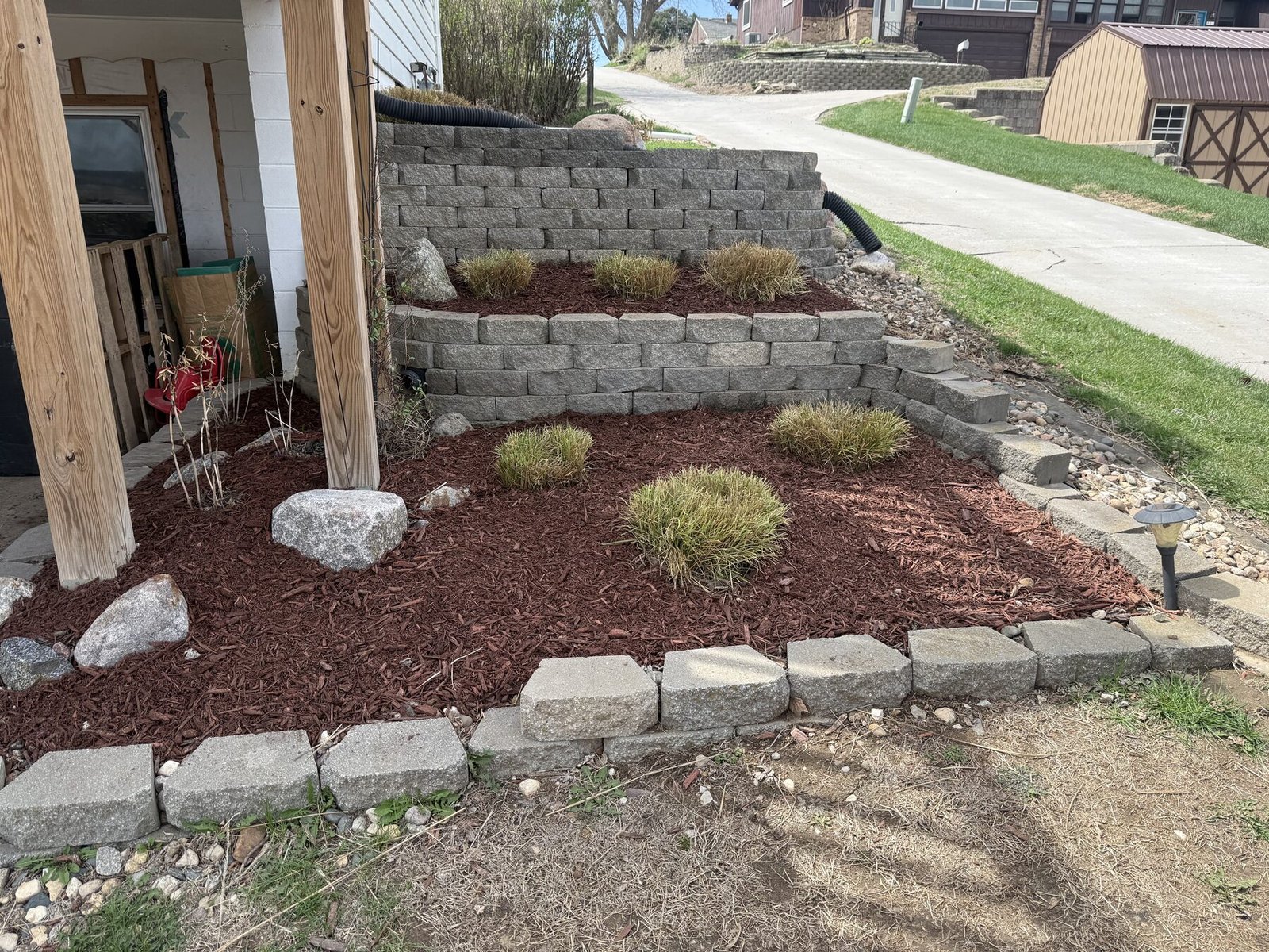 Mulched landscape bed with stone border